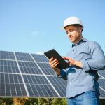 The,Solar,Farm(solar,Panel),With,Engineer,Check,The,Operation,Of